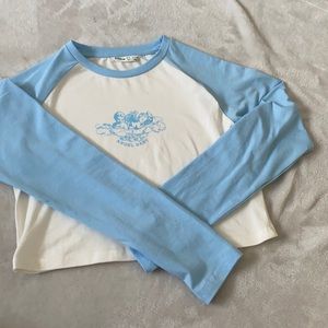 A baby blue angle long sleeve tee shirt